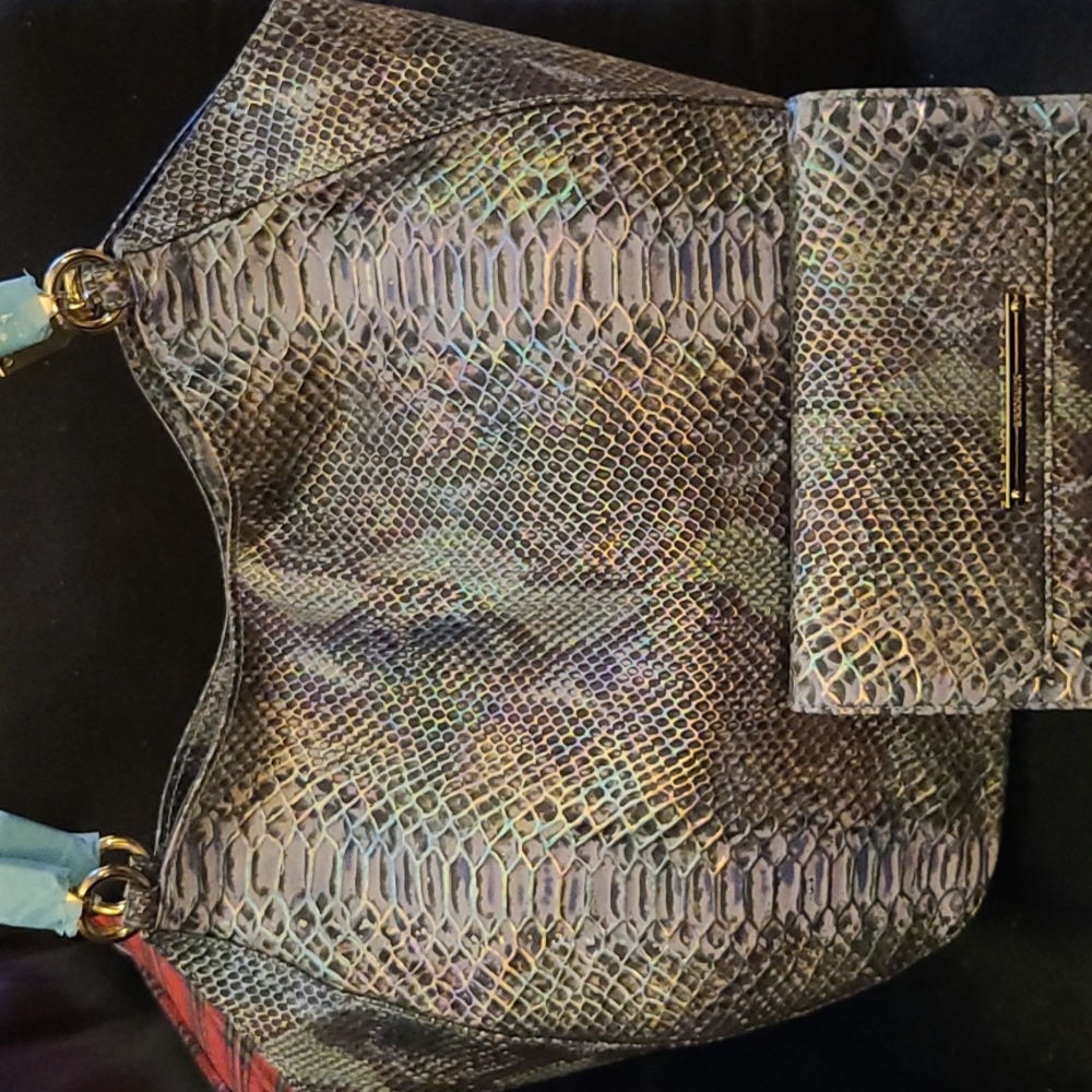 Brahmin bag with matching checkbook wallet and has dust cover.